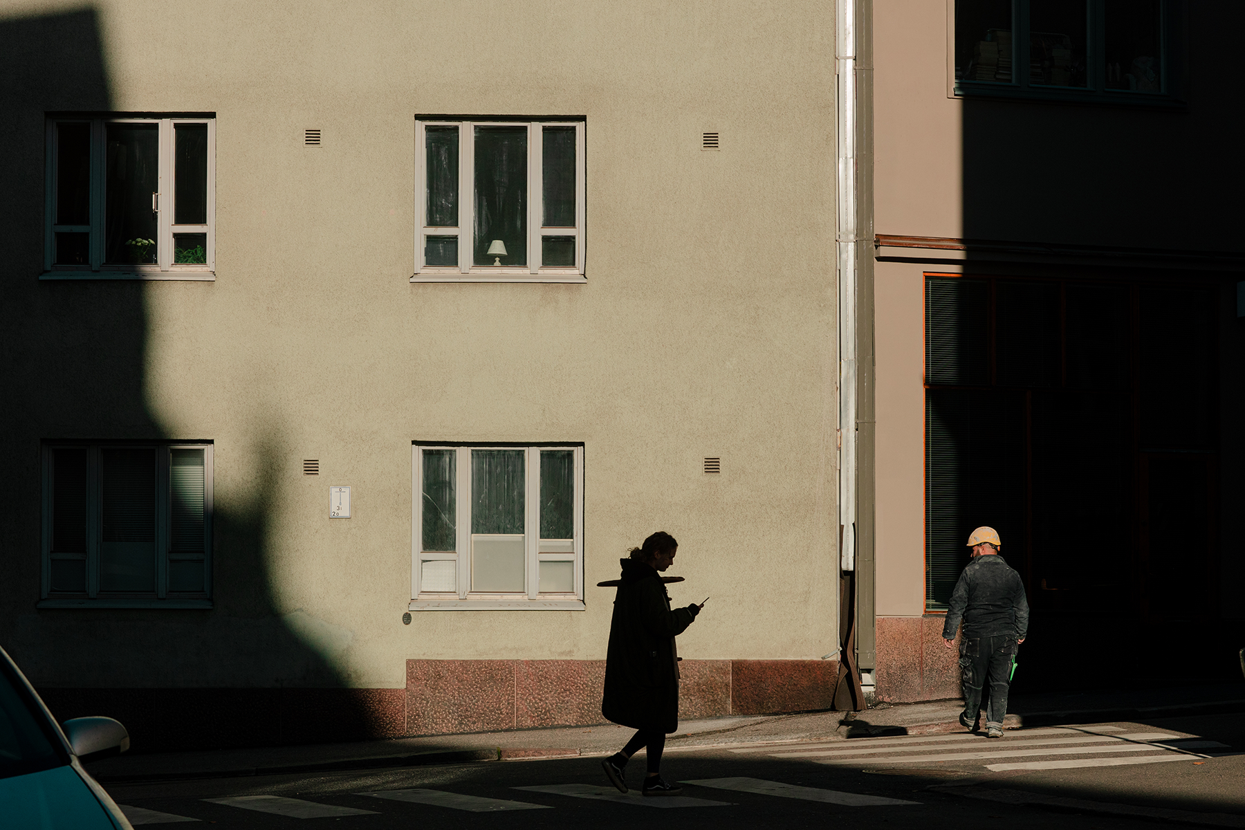 Illustration - sunny street view with a dark silhouette of a young woman.