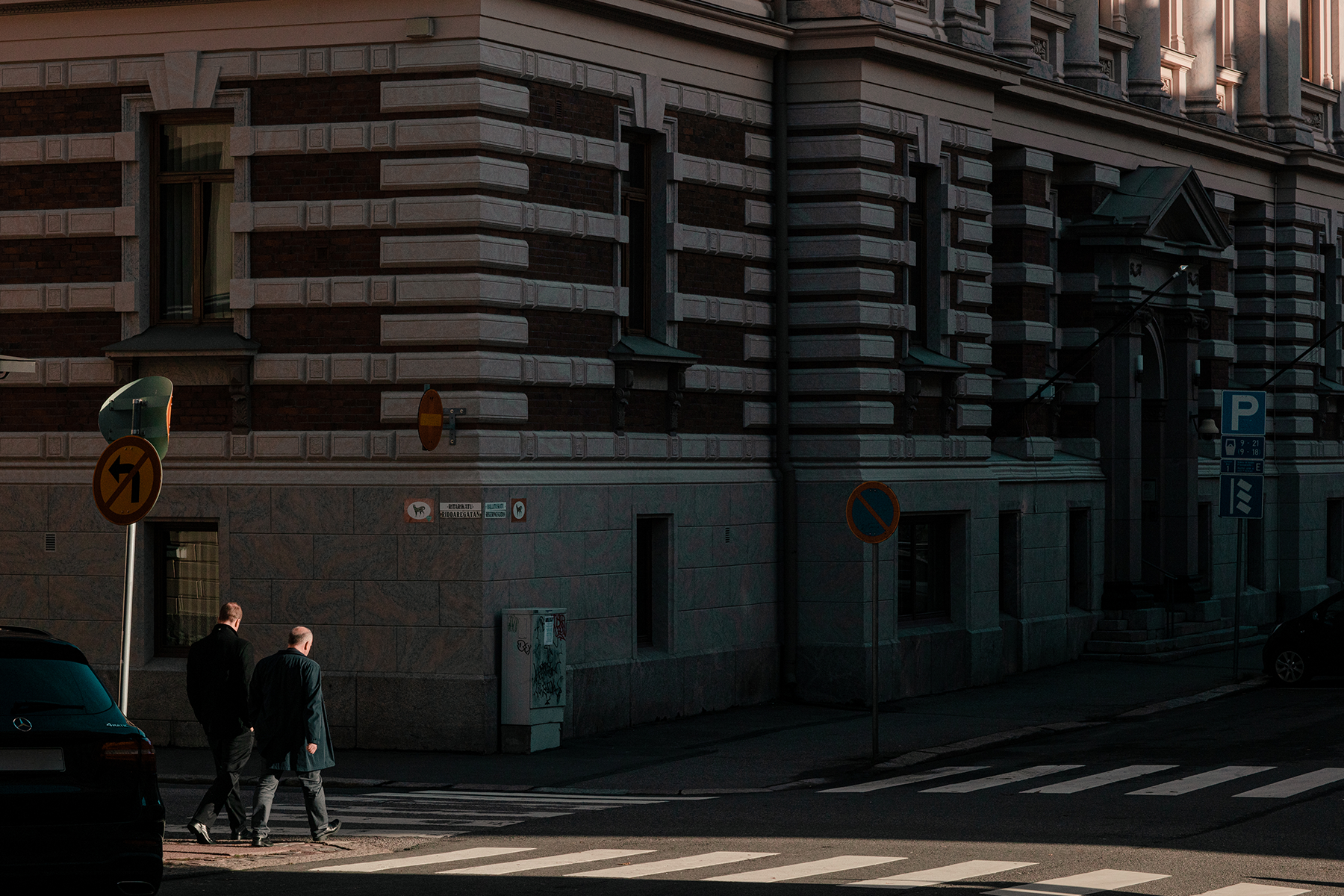 Illustration - two men crossing a street.